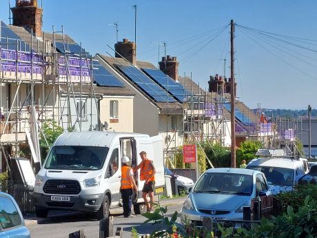 Solar panels on roofs houses with scaffold
