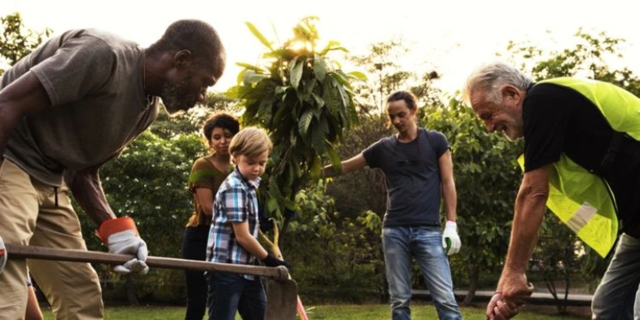 Community members planting a tree